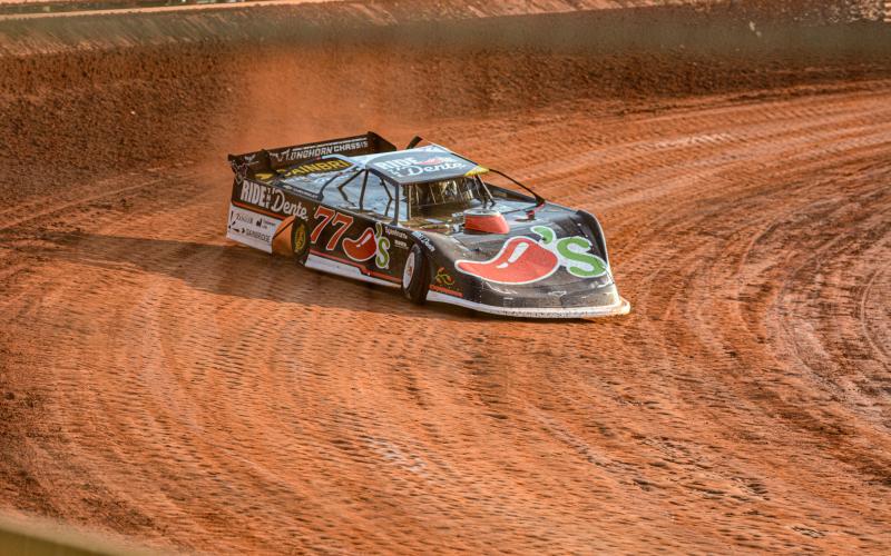 NASCAR Cup Series driver Carson Hocevar drives his No. 77 Ride the ‘Dente Chilli’s Chevrolet into the turn at Lavonia Speedway July 10. Photo by Benjamin London.