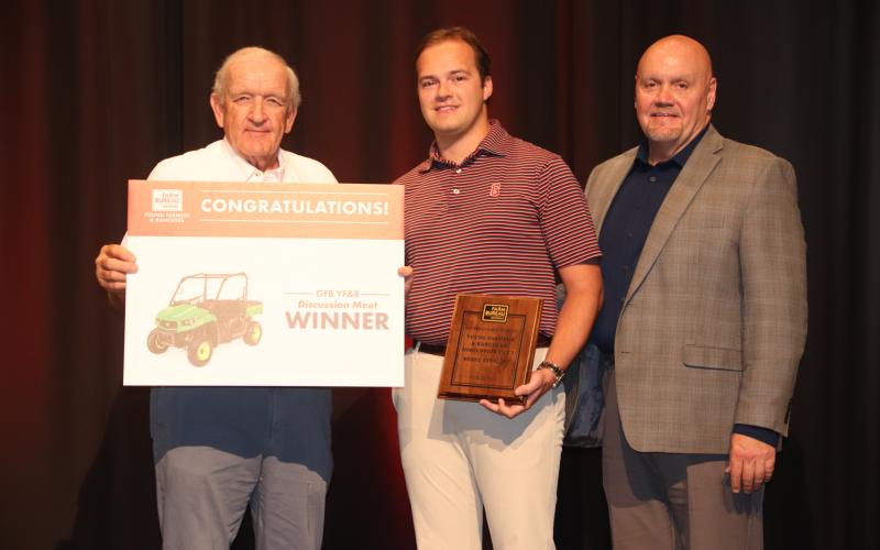 Georgia Farm Bureau President Tom McCall (left) and Tony Hutchins of Southern Farm Bureau Life Insurance (right) congratulate GFB YF&amp;R Discussion meet winner Michael Howard (center). Photo courtesy of Georgia Farm Bureau.