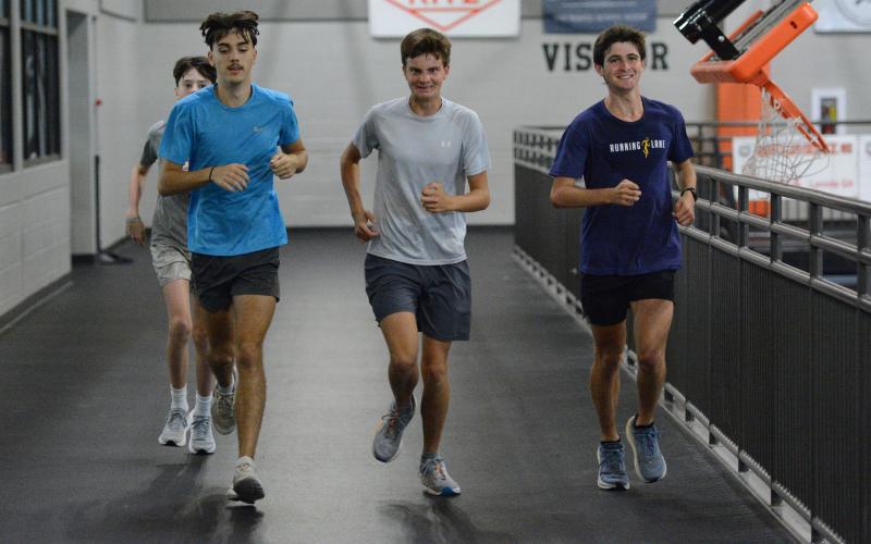 Senior runner Seyvn Singleton jogs around the indoor track at the Hart County High School gym during a practice July 29. Photo by Benjamin London.