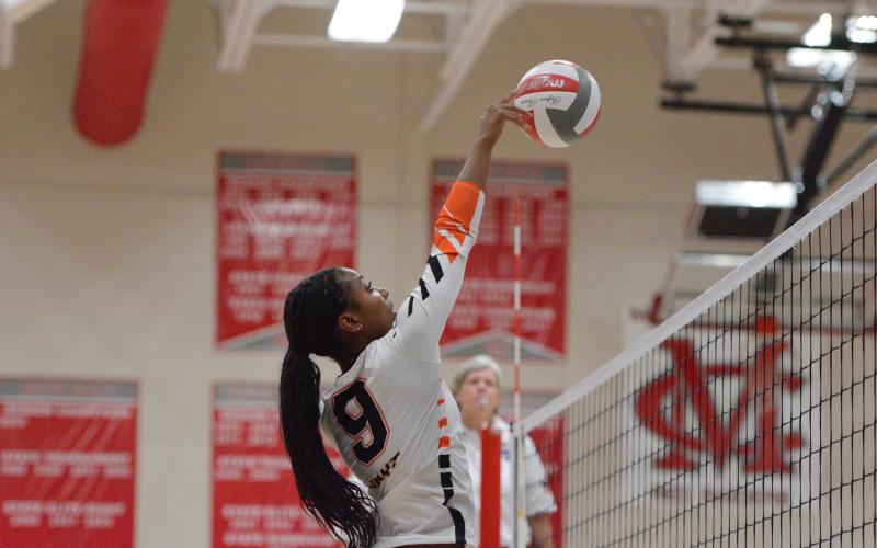 Pictured is middle Trinity Freeman, who goes up for a tip. Photo by Benjamin London.