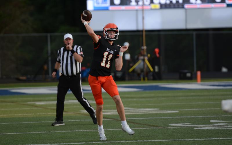 Sophomore quarterback Tucker Parson rears back to throw a pass down field in the 34-26 road win over Oconee County Aug. 13. Photo by Benjamin London.