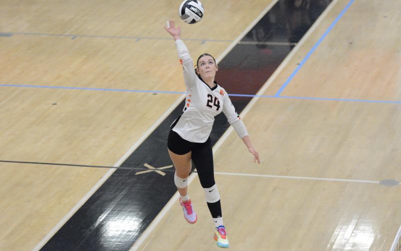 Pictured is junior outside hitter Coley Phillips going up for the kill.  Photo by Benjamin London.