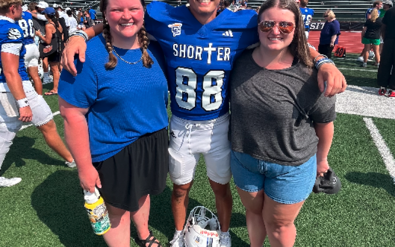 Pictured post-game with our "little" cousin Bryson (center), are Marlie (right) and me. Eight years younger than me and three younger than Marlie, Bryson is in his sophomore year at Shorter University. Photo courtesy of Rose Scoggins.