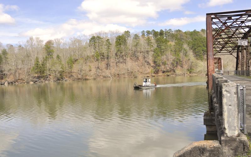 Tom Law / On an early spring day, a Lake Hartwell boater makes his way between the spans of Broken Bridges – traveling directly on the state line of Georgia and South Carolina.