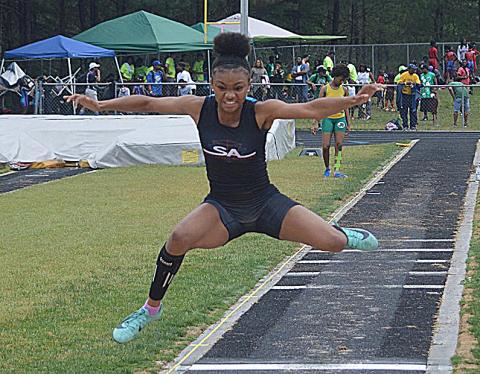 Valasha Carter competes in the triple jump at a recent event. 