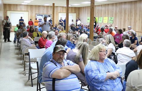 Hart County Board of Commissioners chairman Joey Dorsey stands amid the packed house Tuesday at the Bowersville Town Council meeting to speak on his opposition to speed bumps installed recently on East Main Street in Bowersville. 