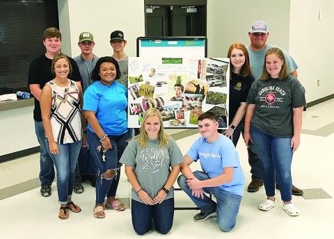 Provided photo — FFA officers show off some of their work at their summer retreat at the Hart County AgriScience Center this past summer. They are, from left to right, Jordan Teel, Anna Smith, Larson Craft, Hannah Ball, Kimberly McCall, Zachary Haygood, Bekah Stewart, Dylan Trotter and Dianna Nolan.