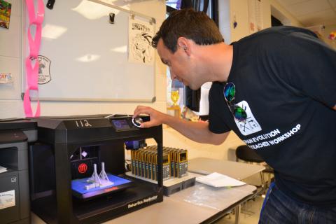 Hart County High School science teacher Justin Lee recently spent some time at a workshop at the University of Florida learning more about human evolution and how to print 3-D replicas of hominid skulls to incorporate into his curriculum. Pictured, Lee readies the 3-D printer at HCHS to give his students the ultimate experience on the subject.