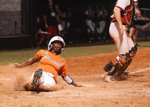 Sunshot by Grayson Williams — Hart County’s Red Campbell slides into home to score in the bottom of the sixth inning on Aug. 15 against Morgan County.