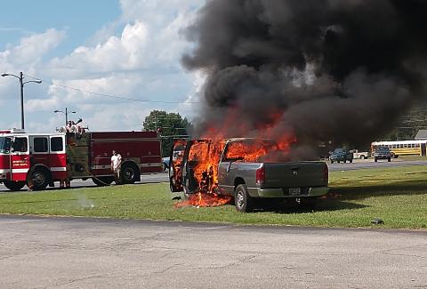 Photo submitted by Anna Hall — A Dodge Ram is engulfed in flames Thursday in the parking lot of the old Bells Shopping Center on Athens Street. 