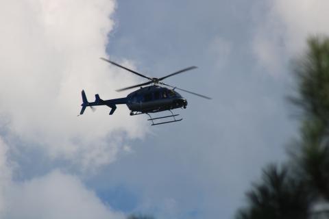 Sunshot by Grayson Williams — A Georgia State Patrol helicopter aids local law enforcement in a search for a man who ran during the execution of a search warrant on Liberty Hill Church Road.