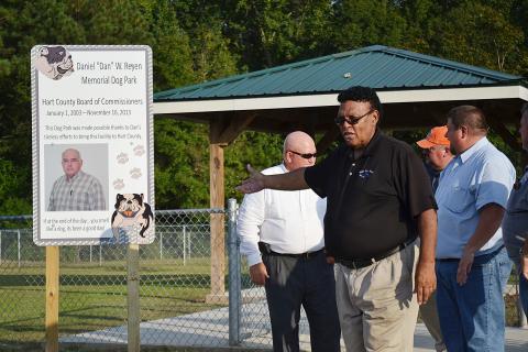 Sunshot by Michael Hall — Hart County Commissioner R.C. Oglesby talks during the dedication ceremony on Sept. 5 naming the dog park at the Hart County recreation complex after the late commissioner Dan Reyen. 