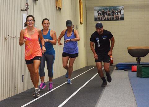 Sunshot by Michael Hall -- Julie George, left, Julie Boleman, second from left, Kay Ankerich, second from right a Andrew Wilder, right, start the first heat of the Honor the Heroes Fitness Challenge on Labor Day at the Bell Family YMCA.