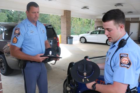 Sunshot by Grayson Williams — Georgia State Patrol Post 52 commander Tracy Webb, left, and Trooper Jesse Lamb, right, show off their trooper hats, which they say are a symbol of professionalism. 