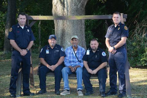Sunshot by Michael Hall — Hartwell firefighter Jonathan Miller, from left, Hart County EMT Ronald Dutton, Raisel HM RA, Hart County EMT Ronnie Thompson and Hartwell firefighter Bobby Lewis pose for a photo after talking about the experience when the first responders, including firefighter John Moore and EMT Brian Evans, not pictured, saved HM RA’s life.