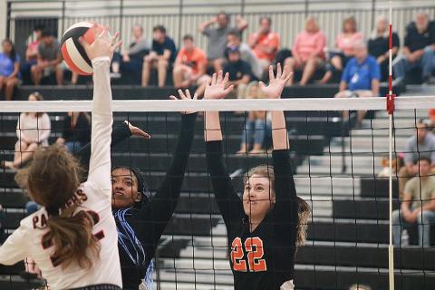 Sunshot by Grayson Williams — Hart County Volleydogs Perrisha Allen and Madison Wolfe go for the block against Jackson County on Sept. 5 at Hart County High School.