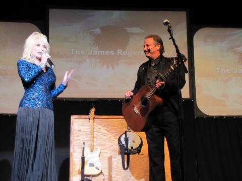 James Rogers performs with Dolly Parton