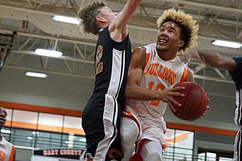 Photo submitted — Hart County sophomore Sean Teasley, right, takes the ball to the hoop in a game last season at the Hart County High School gym. Teasley has been chosen to represent the US team in an international competition. 