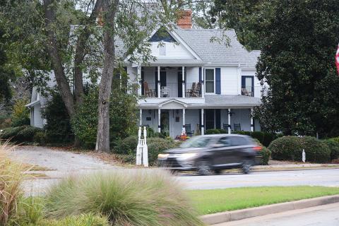 Sunshot by Michael Hall — Traffic passes on Benson Street Wednesday morning in front of the Skelton house. 
