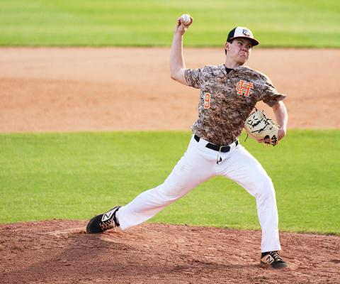 Sunshot by Grayson Williams. Casey Tallent pitches in April against Franklin County.