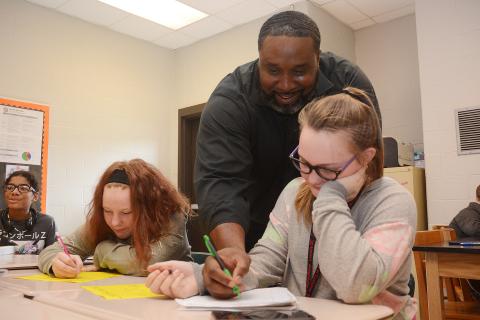 Sunshot by Michael Hall — Middle school teacher Earl Fouch helps students during a math exercise at Hart County Middle School on Monday, Nov. 4. 