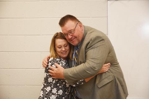 Sunshot by Michael Hall — Hart County Teacher of the Year Christie Simpson, left, hugs Superintendent Jay Floyd on Nov. 15 at the Hart College and Career Academy’s community room after she was announced as the system-wide winner of the award. 