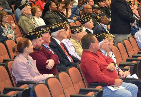 Sunshot by Drew Dotson - Veterans sit and listen to the program put on at Hart County High School on Veterans Day at the Lonnie Burns Fine Arts Center.