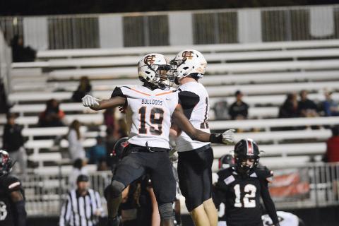 Hart County's Malachi Thomas, who finished with four touchdowns, 290 yards rushing and an interception in the game, celebrates with quarterback Luke Lee in the Bulldogs' win over Morgan County.