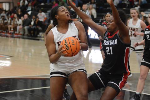 Sunshot by Grayson Williams - Taniya Alexander fights to get a shot up under the basket on Dec. 6 against Morgan County at Hart County High School. 