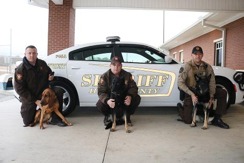 Sunshot by Grayson Williams - Pictured from left to right are, deputy Jarod Tollison and Parker Jean, deputy Josh Fowler and Chuck and deputy Steve Williams and Sena.