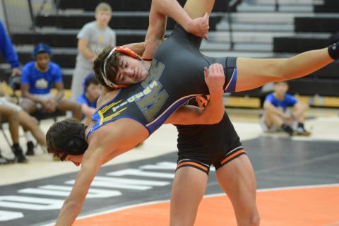 Sunshot by Grayson Williams - Hart County’s Ayers Honiotes takes down a Washington-Wilkes opponent at Hart County High School on Dec. 4.
