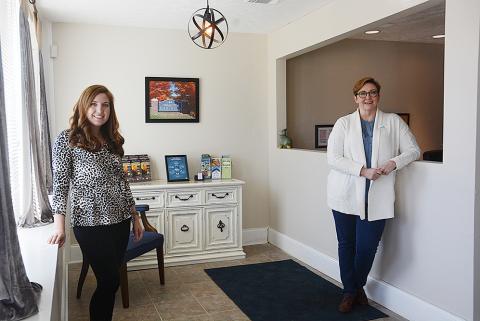 Hart County Chamber of Commerce director Christine Blomberg and Tiffany Rucker stand in the lobby of the chamber offices on Carolina Street. 