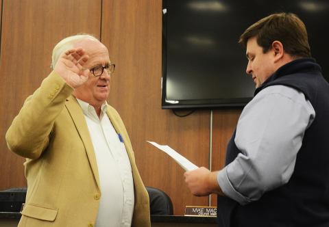 Sunshot by Michael Hall - New Hartwell city councilman Stephen “Doc” Ayers, takes his oath of office, administered by city manager Jon Herschell, at the first city council meeting of the year on Jan. 6.
