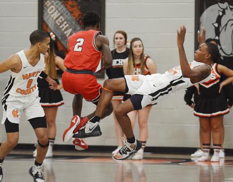 Hart County Junior Shone Webb falls backward after colliding with Stephens County’s Chris Sinclair at Hart County High School on Jan. 24.  