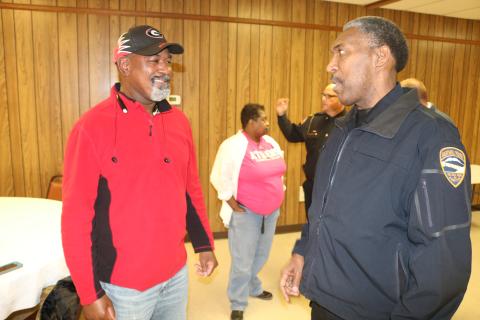 Sunshot by Grayson Williams - Hartwell Police chief Anthony Davis, right, talks to Paul Simpson, left, at the GBI’s gang awareness event on Jan. 16 in Lavonia. 