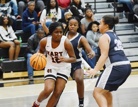 Sunshot by Grayson Williams - Hart County’s Shakendra Grove drives the baseline in the McDonald’s Shootout championship game on Dec. 30 at Hart County High School. The Lady Dotgs’ took second place in the tournament. 