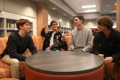 Leadership Hart Youth participants Sean Leard, from left, Ben Tellano, Adam Walters and A.J. Johnson talk about their project at Hart County High School recently. 