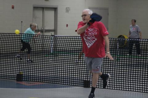 Sunshots by Grayson Williams - Paul Martin, above, volleys during a pickleball game at the Bell Family YMCA in Hartwell on Tuesday.