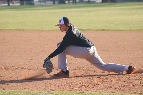 Sunshot by Grayson Williams - Sophomore first baseman Nolan Dean digs a ball out of the dirt last week at Hart County baseball practice. 
