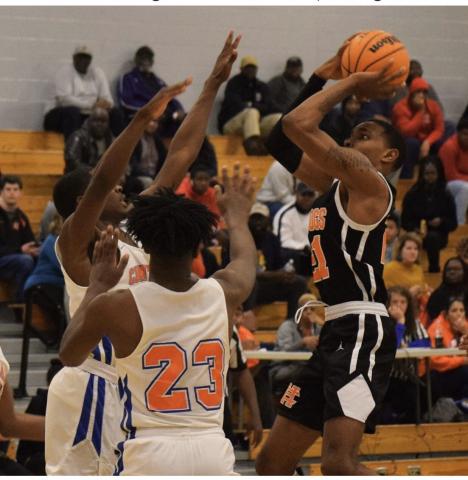 Photo submitted - Hart County’s Shone Webb shoots over Central High School, Macon, players in Macon on Feb. 20. 