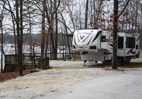 Sunshot by Michael Hall — A fifth-wheel camper is parked at a campsite at what was Hart State Park, and is becoming Hartwell Lakeside. Campground renovations are the first phase of the transformation. 