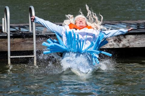 Sunshots by Bill Powell - April Garner, representing The Hartwell Service League, dressed as Alice in Wonderland, plunges after raising $1,700 for the council.