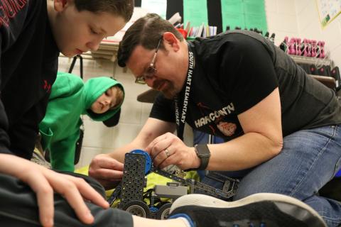 Sunshot by Grayson Williams - South Hart Elementary fifth-grade teacher Josh McCurley, right, works on a robotics project with students recently. McCurley was recently honored as a Georgia STEM Scholar.