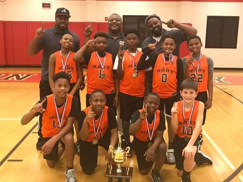 Pictured is the Hart County GRPA 10U Youth Basketball District 7 Championship team. Pictured from left to right are, bottom row, Xavier Cade,  Boss Blackwell, Kamren Brewer, Crew Franklin, middle row, Isaiah Porter-Allen, Bryshun Jordan, Cincere Roebuck, Kurston Curry, Marquez Goss, back row, coaches Kurvin Curry, Phil Blackwell and Ron Allen.