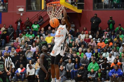 Sunshot by Grayson Williams Hart County’s Tahj Johnson throws down a dunk during the region tournament at Emmanuel College in February. Johnson named class AAA freshman of the year by two recruiting websites. 