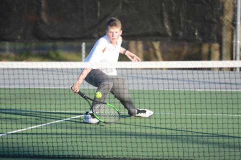 Sunshot by Grayson Williams - Hart County’s No. 2 singles player, Michael Floyd, returns a volley on March 6 at Hart County High School. 
