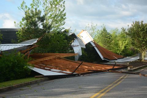 Sunshot by Michael Hall — The roof of a boat storage building was blown off its structure and into the entrance of the Hart County Parks and Recreation Department park on Elberton Highway early Monday. 