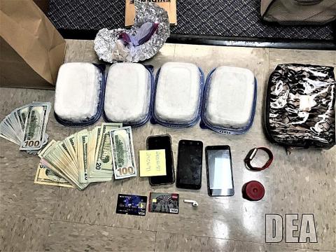 Drugs, money and other items confiscated as part of a two-year federal, state and local drug investigation are shown. 