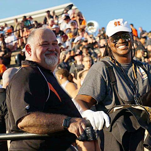 Photo submitted — Hart County High School band director Alan Tolbert, left, poses for a photo during a band competition with Rendarris Gaines, a recent HCHS graduate who recalls Tolbert as his favorite teacher. 