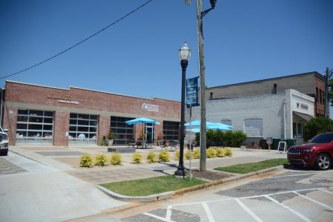 Sunshot by Michael Hall — Elizabeth Cakes by Design, left, Common Ground, middle and the Hart County Chamber of Commerce, right, are shown on Carolina Street in downtown Hartwell recently. A block party is scheduled for July 22 for those and other new businesses on the street. 